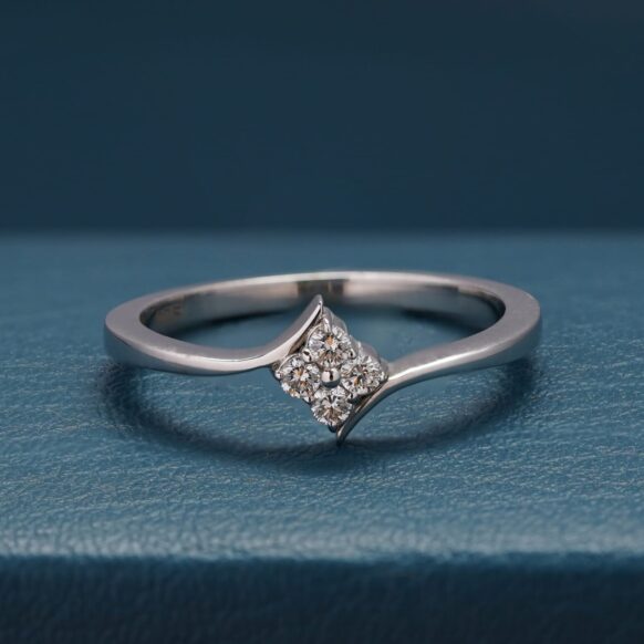 highlights the four-diamond floral cluster and silver band